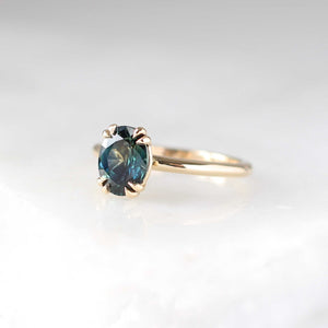 Teal sapphire solitaire ring three quarter view