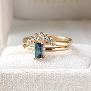 Teal blue sapphire ring with diamond band