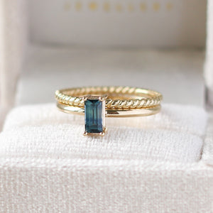 Teal blue sapphire ring with rope band