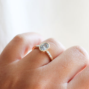 Oval salt and pepper diamond ring three quarter view on hand