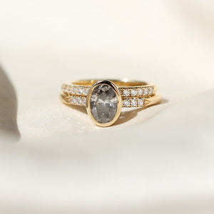 Oval salt and pepper diamond ring with diamond band