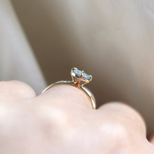 Round diamond ring on hand in sunlight side view