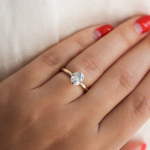 Oval Brilliant cut diamond ring on hand