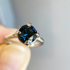 Round rose cut blue sapphire ring in hand 