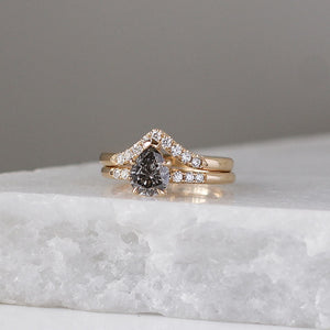Diamond Point Gold Band stacked pear diamond ring on marble quarter view