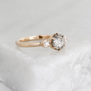 Round rose cut diamond in yellow gold on marble quarter view