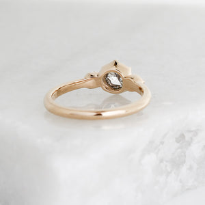 Rose cut diamond ring in yellow gold on marble rear detail view