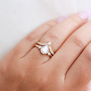 Pear diamond ring with diamond band on hand