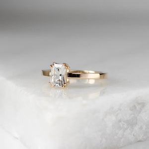 White Sapphire Gold Ring on marble quarter view