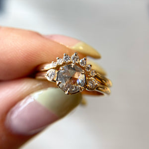Rose cut diamond ring paired with diamond gold stacking band  in hand