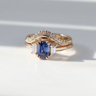 Emerald cut blue sapphire and diamond ring
