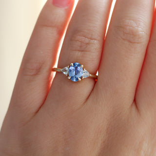 oval blue sapphire ring on hand