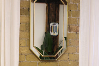 Toronto based jewellery studio with mirror hanging on the wall