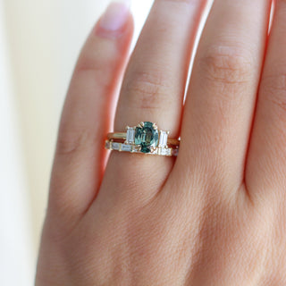 green oval cut sapphire ring