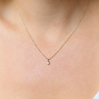 Round Lab Diamond Necklace in yellow gold being worn