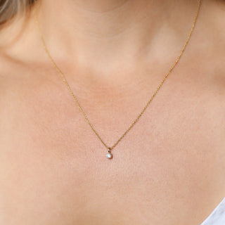 Round Lab Diamond Necklace in yellow gold being worn