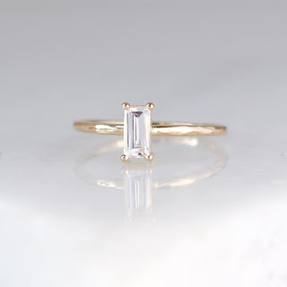White sapphire ring stacker in yellow gold front view