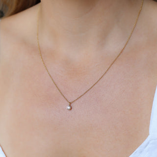 Round Lab Diamond Necklace in yellow gold being worn