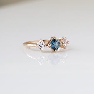 Blue Cushion Cut Montana Sapphire Three Stone Ring quarter view
