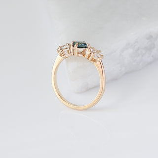 Blue Cushion Cut Montana Sapphire Three Stone Ring profile view 