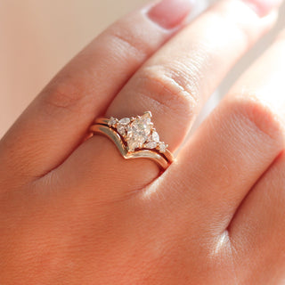 Folia Marquise Cut Champagne Diamond Ring with wave gold band worn on hand