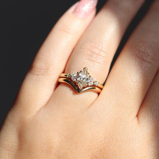 Folia Marquise Cut Champagne Diamond Ring with wave gold band worn on hand in sunlight