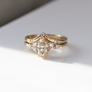 Folia Marquise Cut Champagne Diamond Ring stacked with three point diamond gold band front view