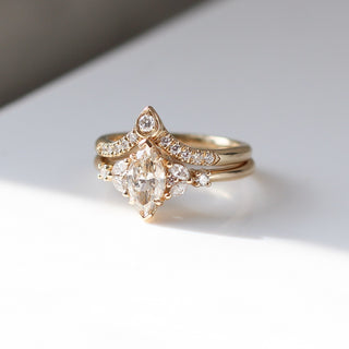 Folia Marquise Cut Champagne Diamond Ring stacked with Gold diamond band in sunlight quarter view
