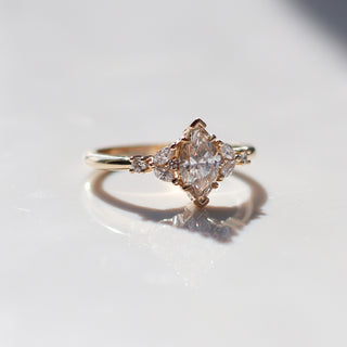 Folia Marquise Cut Champagne Diamond Ring quarter side view with reflections in sunlight