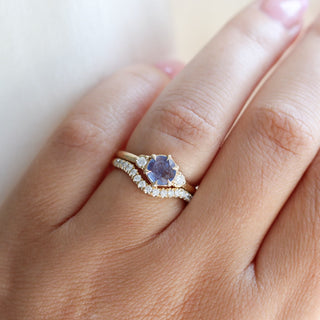 Round Blue Sapphire Ring with diamond gold band worn on hand