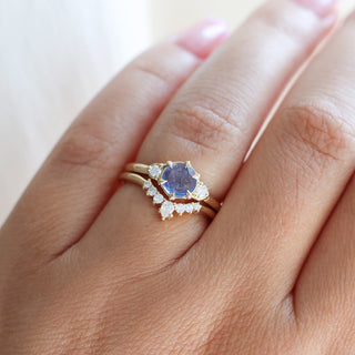 Round Blue Sapphire Ring with crown diamond gold band worn on hand