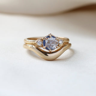 Round Blue Sapphire Ring stacked with wave gold band on fabric detailed front view