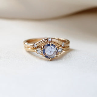 Round Blue Sapphire Ring paired with 3 point diamond gold band front view