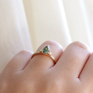Pear Cut Green Sapphire ring worn on hand side profile view