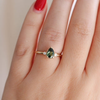 Pear Cut Green Sapphire ring on hand