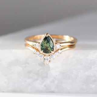  Pear Cut Green Sapphire ring stacked diamond crown band on marble