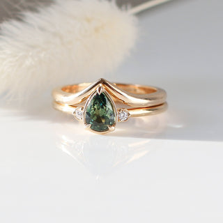  Pear Cut Green Sapphire ring paired with wave gold band with feather 