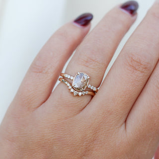 Oval Cut Diamond Ring with crown diamond gold band worn on hand detail view