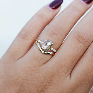 Oval Cut Diamond Ring with diamond gold band worn on hand front view