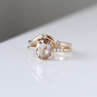 Oval Cut Diamond Ring paired with wave diamond band detail front view