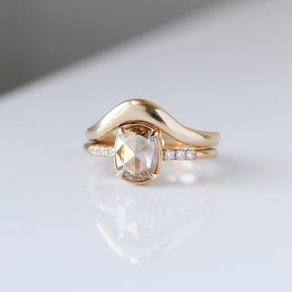 Oval Cut Diamond Ring paired with wave gold band front detail view