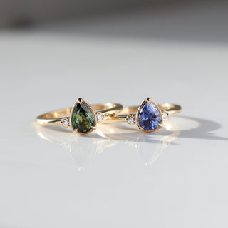 Pear Cut Purple and Green Sapphire rings front view 