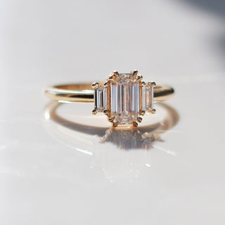 Emerald cut champagne diamond ring with baguette side stones in yellow gold, front view