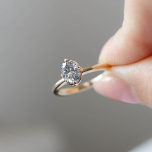 Oval Salt and Pepper Diamond Ring in hand
