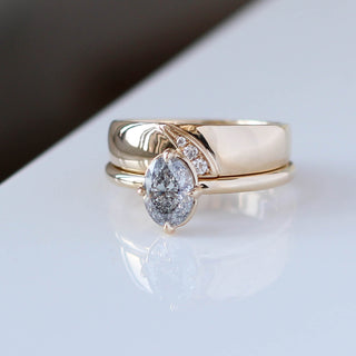 Oval Salt and Pepper Diamond Ring stack on white table close up