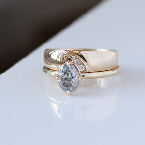 Oval Salt and Pepper Diamond Ring stack on white table close up