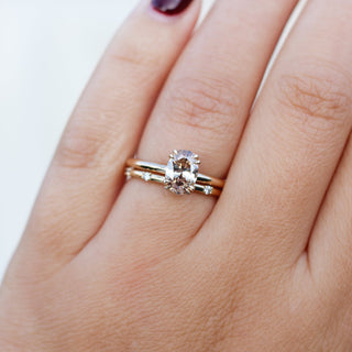 Oval Cut Diamond Ring with diamond gold band worn on hand front view