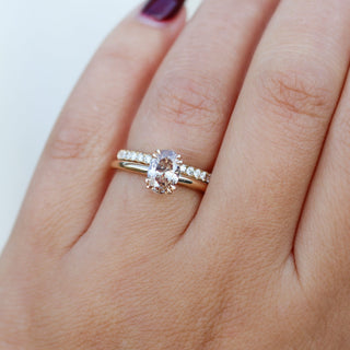 Oval Cut Diamond Ring paired with diamond gold band worn on hand front view