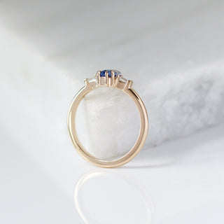 Shield Cut Blue Sapphire Ring profile view on marble 