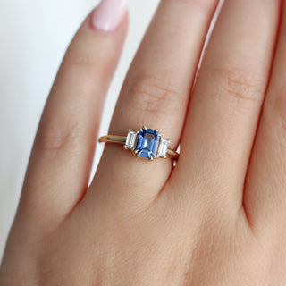  Emerald Cut Blue Sapphire Ring being worn